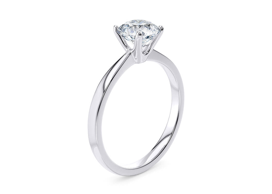 Elegante anello solitario in oro 18 carati con un singolo diamante brillante incastonato. Simbolo di amore e promessa, perfetto per un fidanzamento.