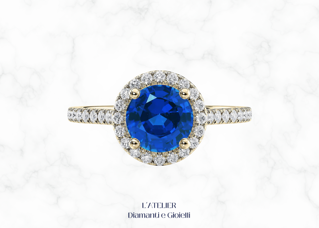 Anello in oro con zaffiro naturale e diamanti a contorno halo. L'Atelier Diamanti e Gioielli Roma.