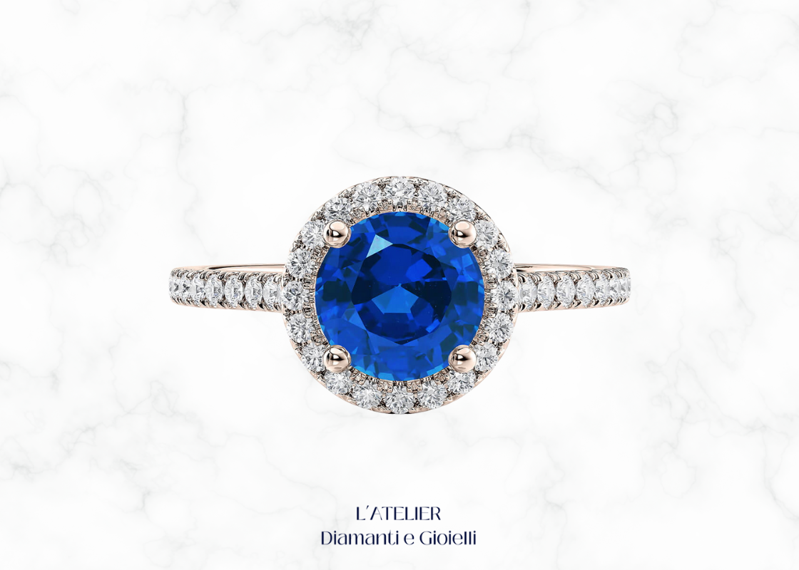 Anello in oro con zaffiro naturale e diamanti a contorno halo. L'Atelier Diamanti e Gioielli Roma.