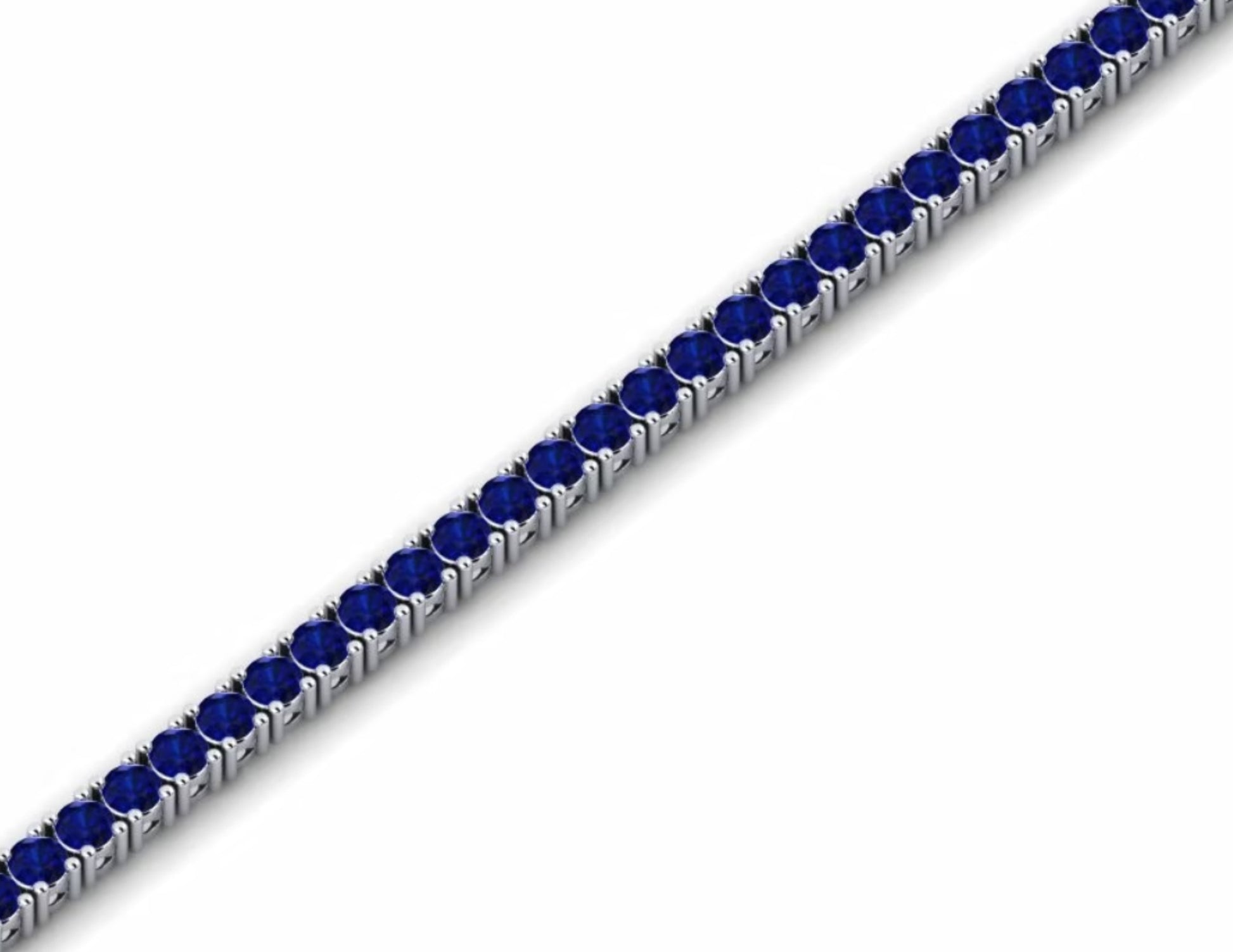 Elegante bracciale tennis con zaffiri blu intenso incastonati su oro bianco o platino, su sfondo scuro. Gioiello di lusso e raffinatezza.